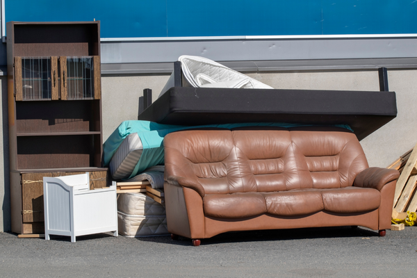 furniture-moving-mngmovers Used furnitures outside and ready to be loaded to a moving truck for relocation