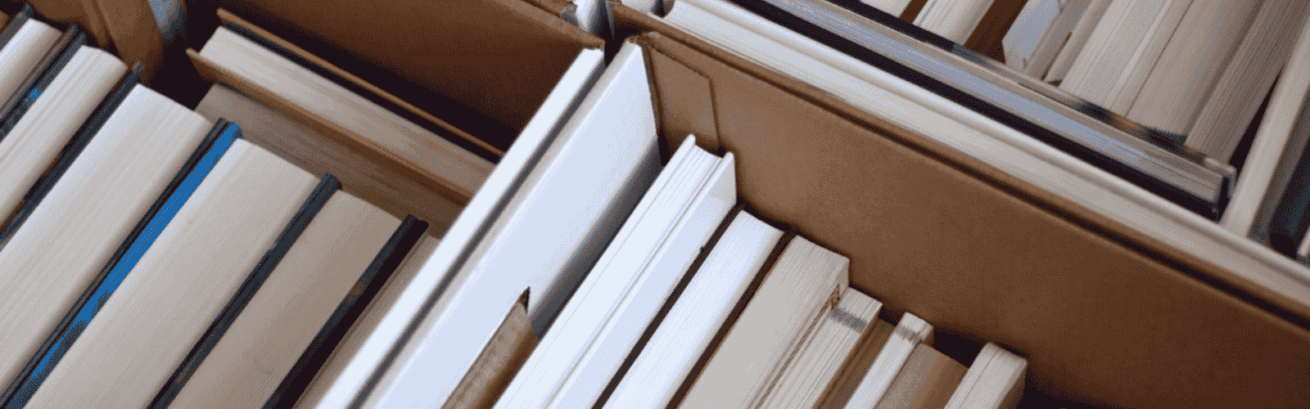 Different types of books store in an open carton boxes.