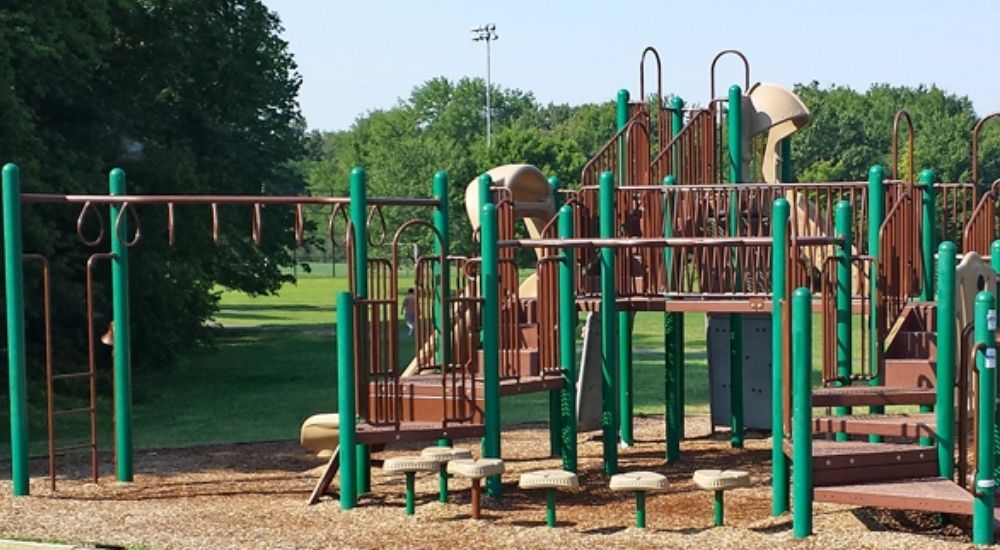 Playground structure at Ellanor C. Lawrence Park in Centreville, Virginia, with slides, monkey bars, and climbing areas.